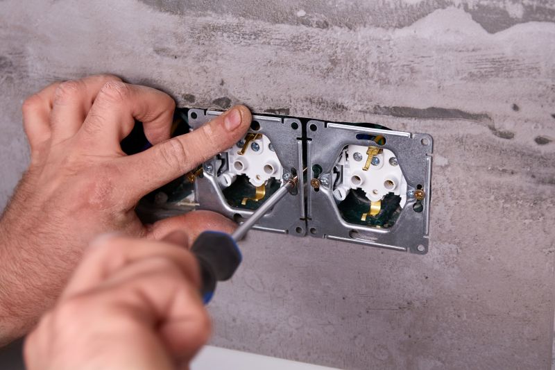 Handyman Working on Electrical Outlet